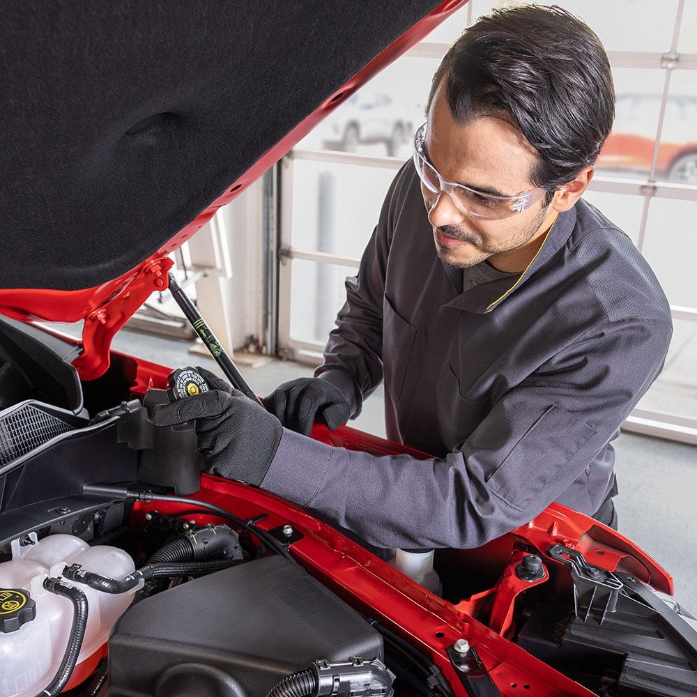 Service employee working on car